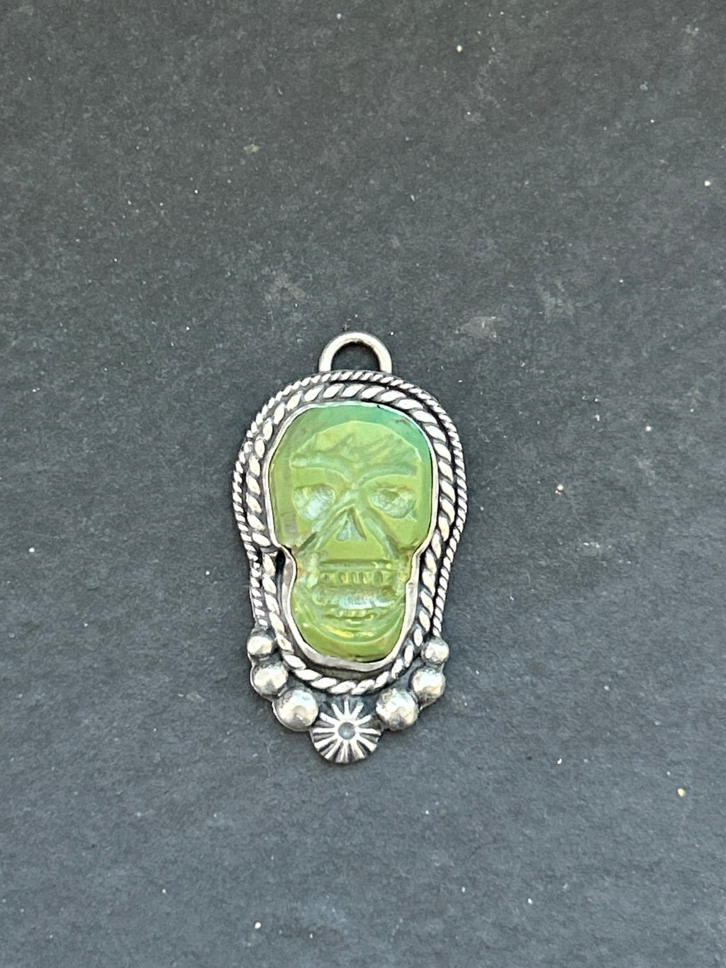 Kingman Turquoise Carved Skull Charm
