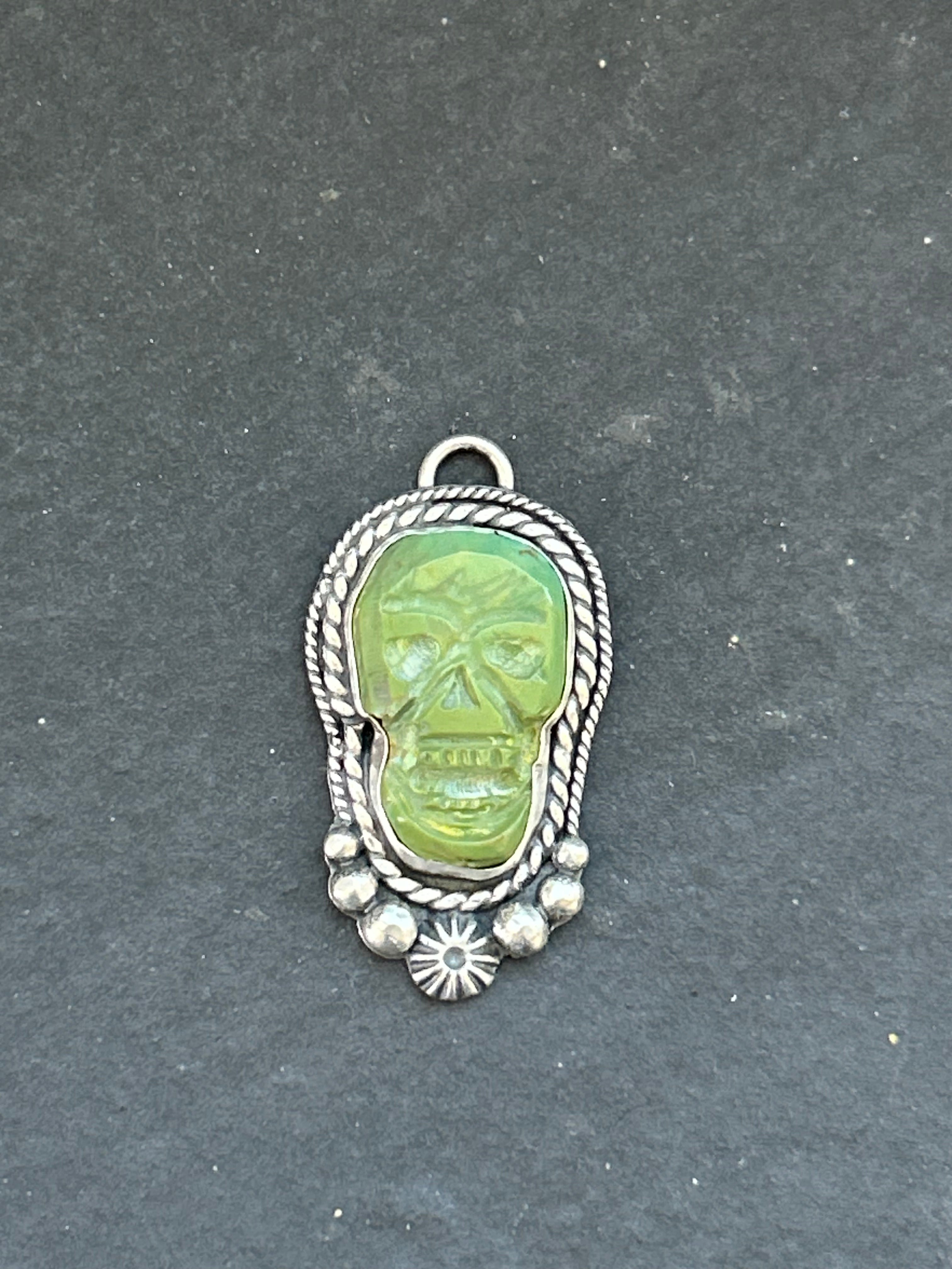 Kingman Turquoise Carved Skull Charm