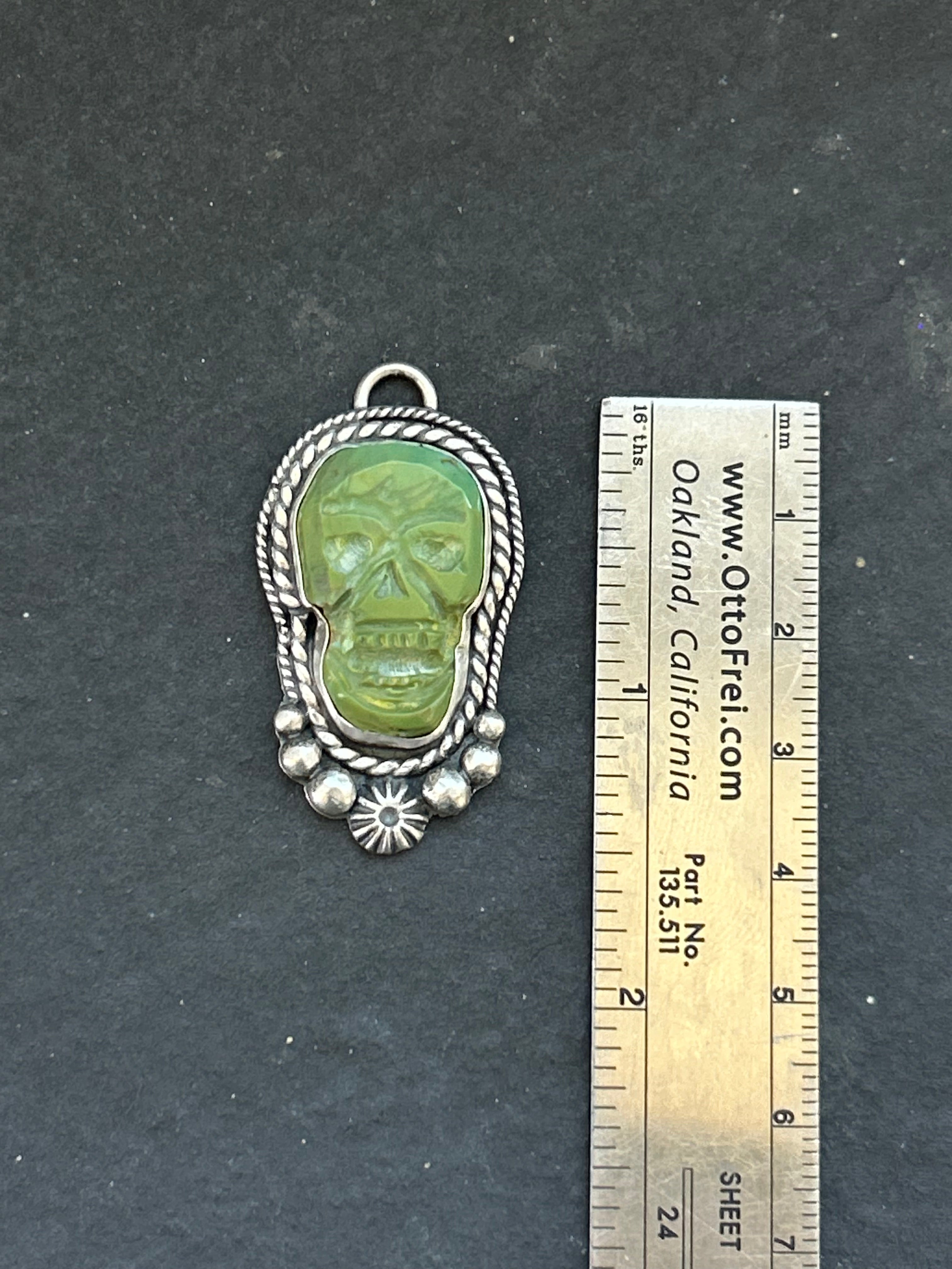 Kingman Turquoise Carved Skull Charm