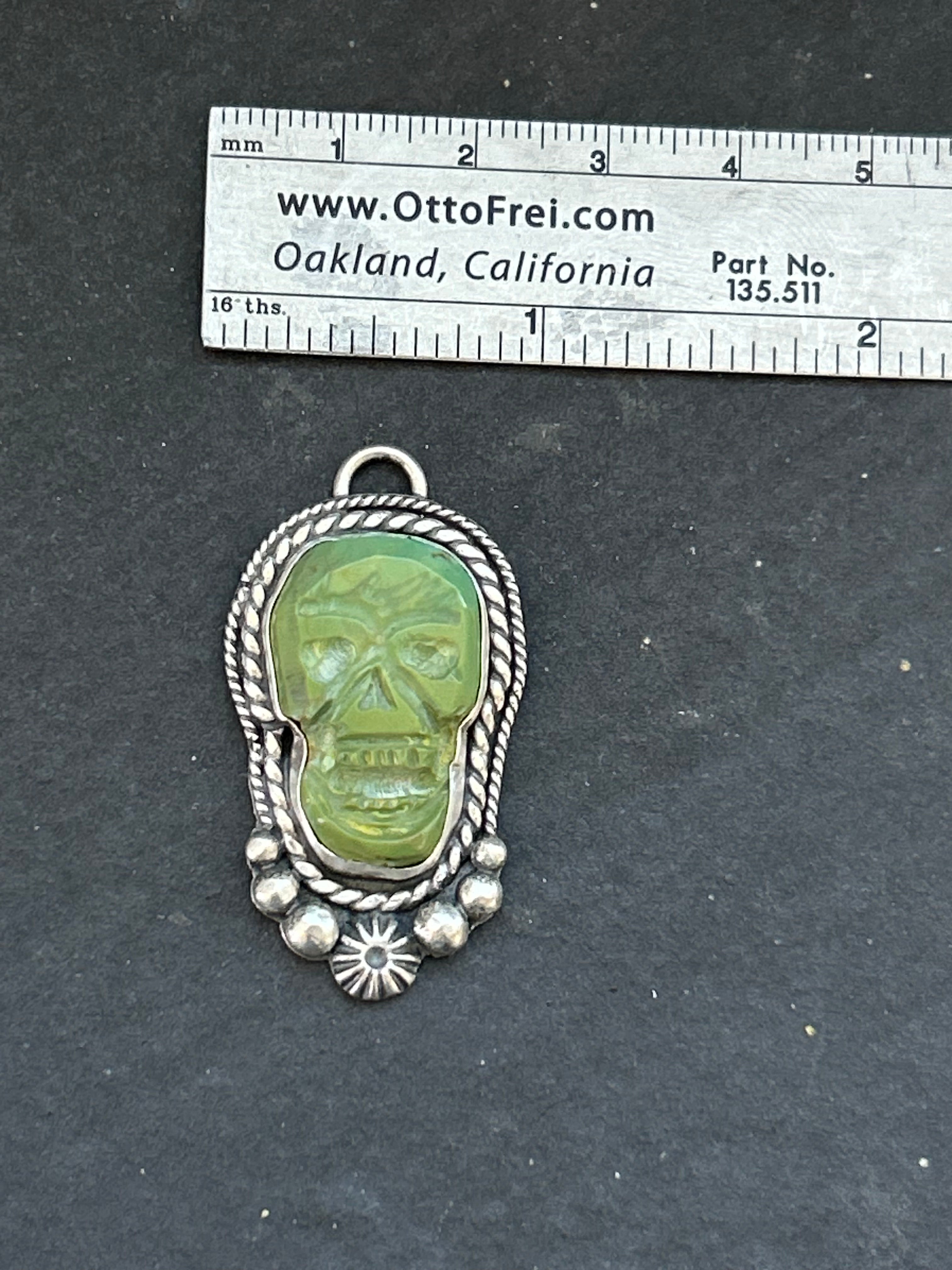 Kingman Turquoise Carved Skull Charm