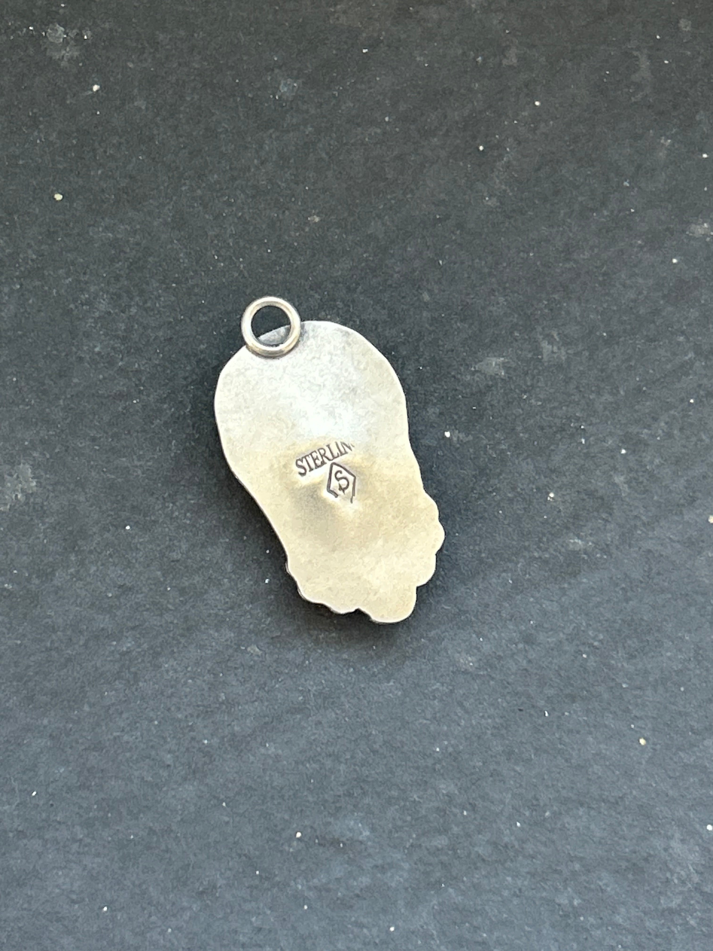 Kingman Turquoise Carved Skull Charm