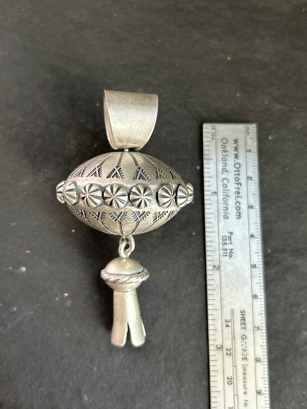 The Sterling Silver Gyrating Tushí Blossom Pendant