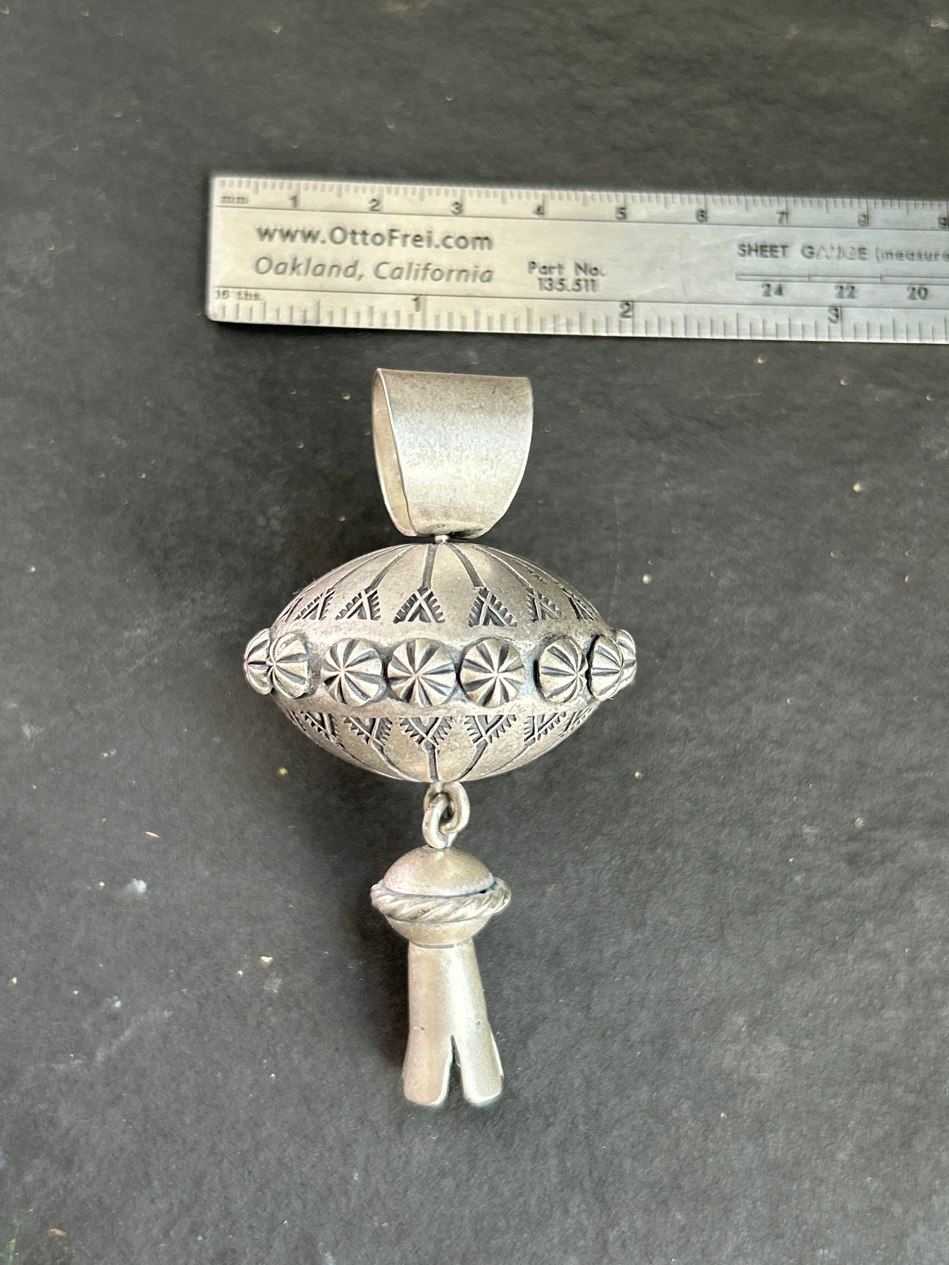 The Sterling Silver Gyrating Tushí Blossom Pendant