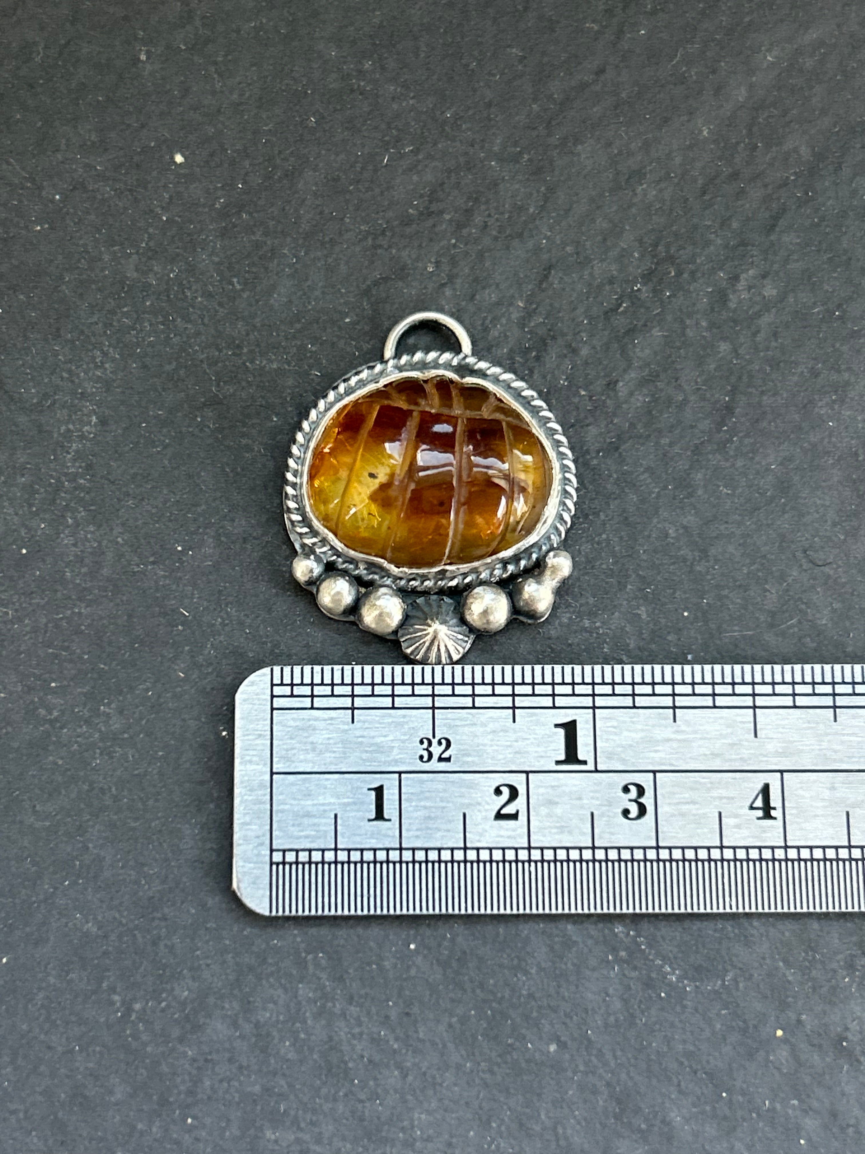 Item #23 Baltic Amber Carved Pumpkin Charm