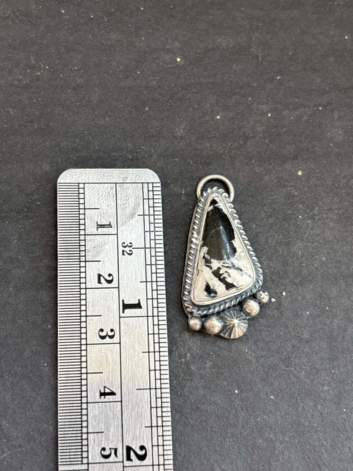 55. White Buffalo Charm