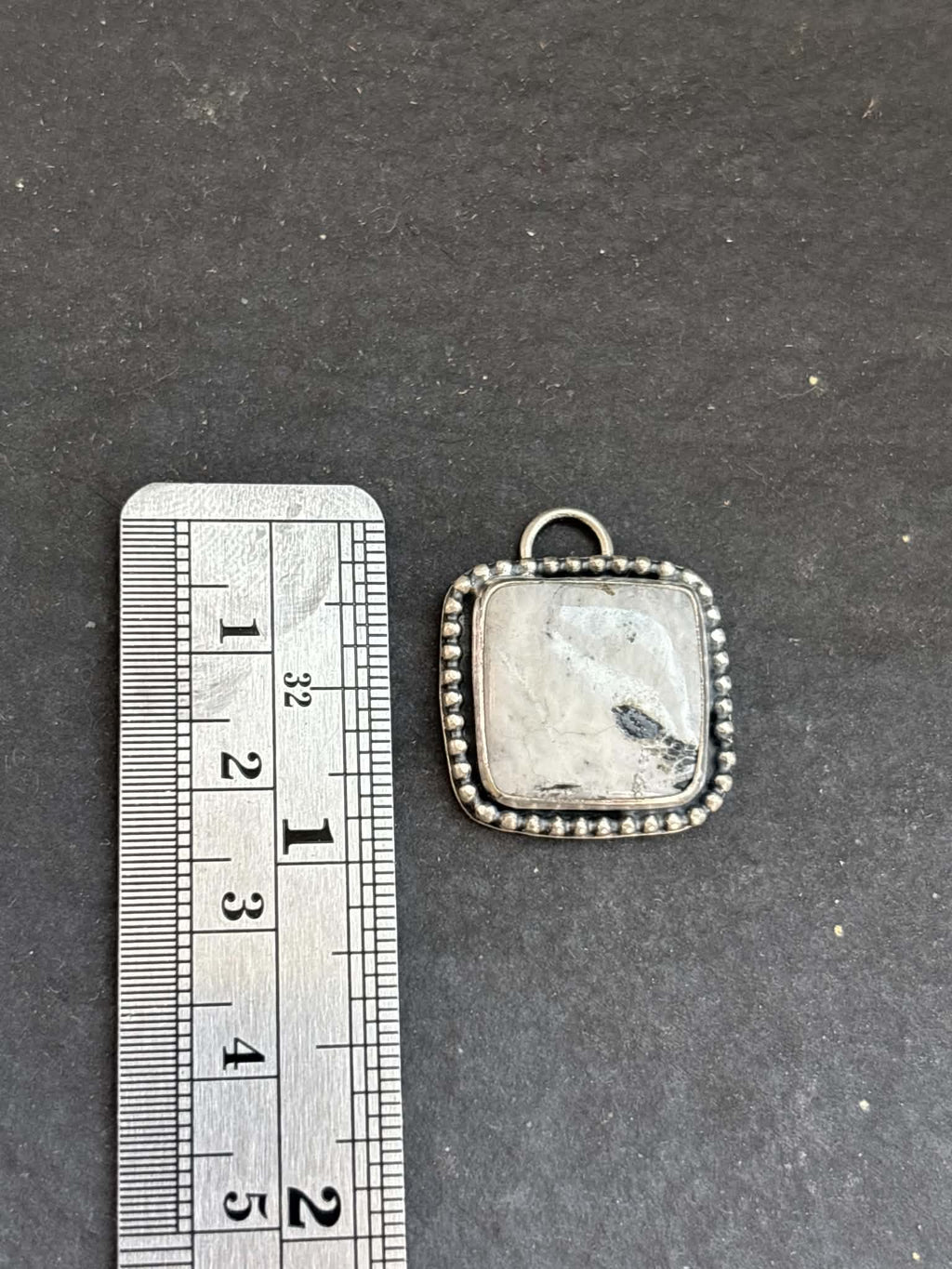 56. White Buffalo Charm