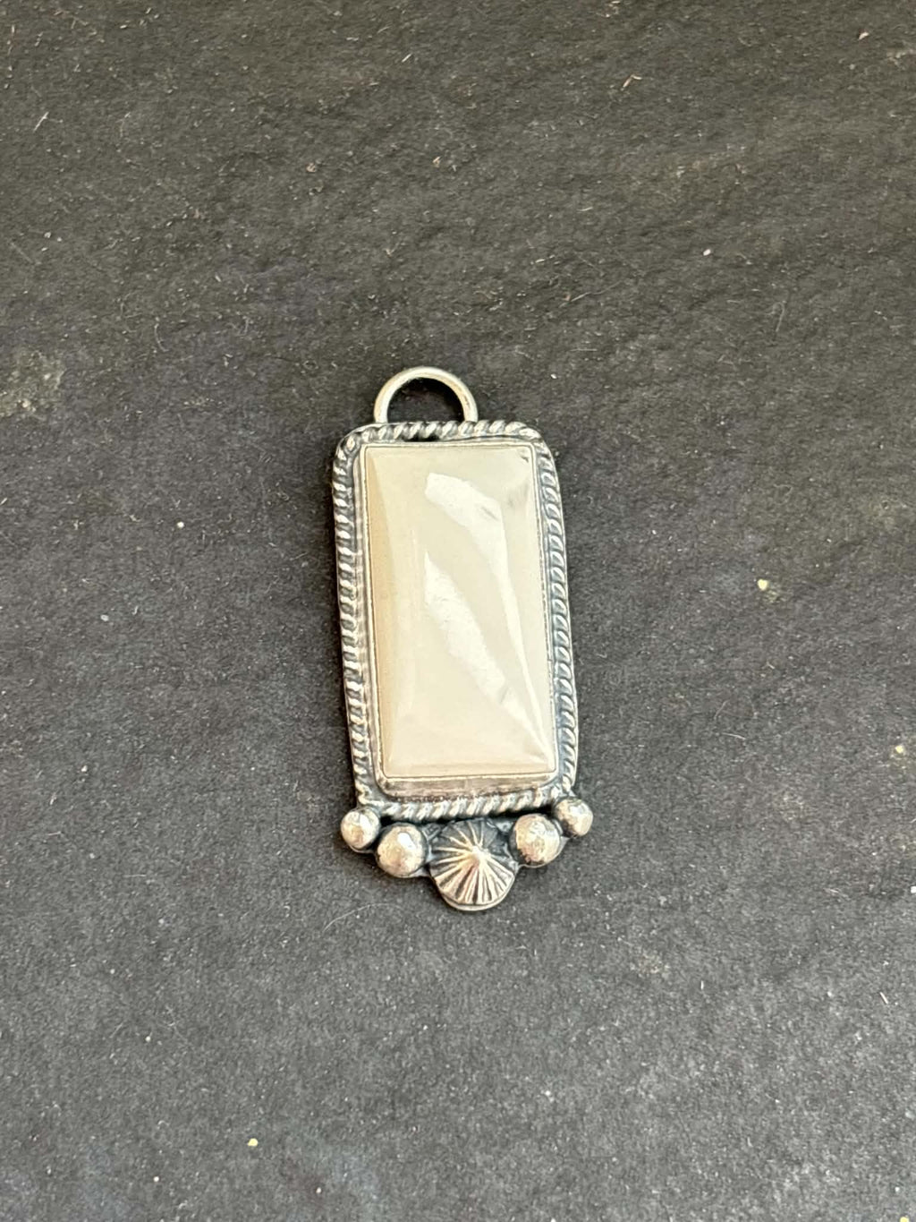 57. White Buffalo Charm