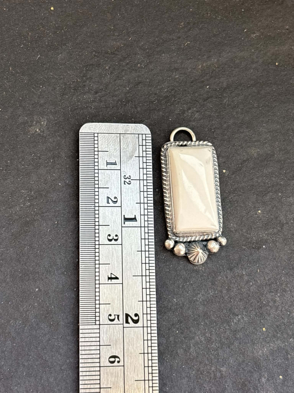 57. White Buffalo Charm