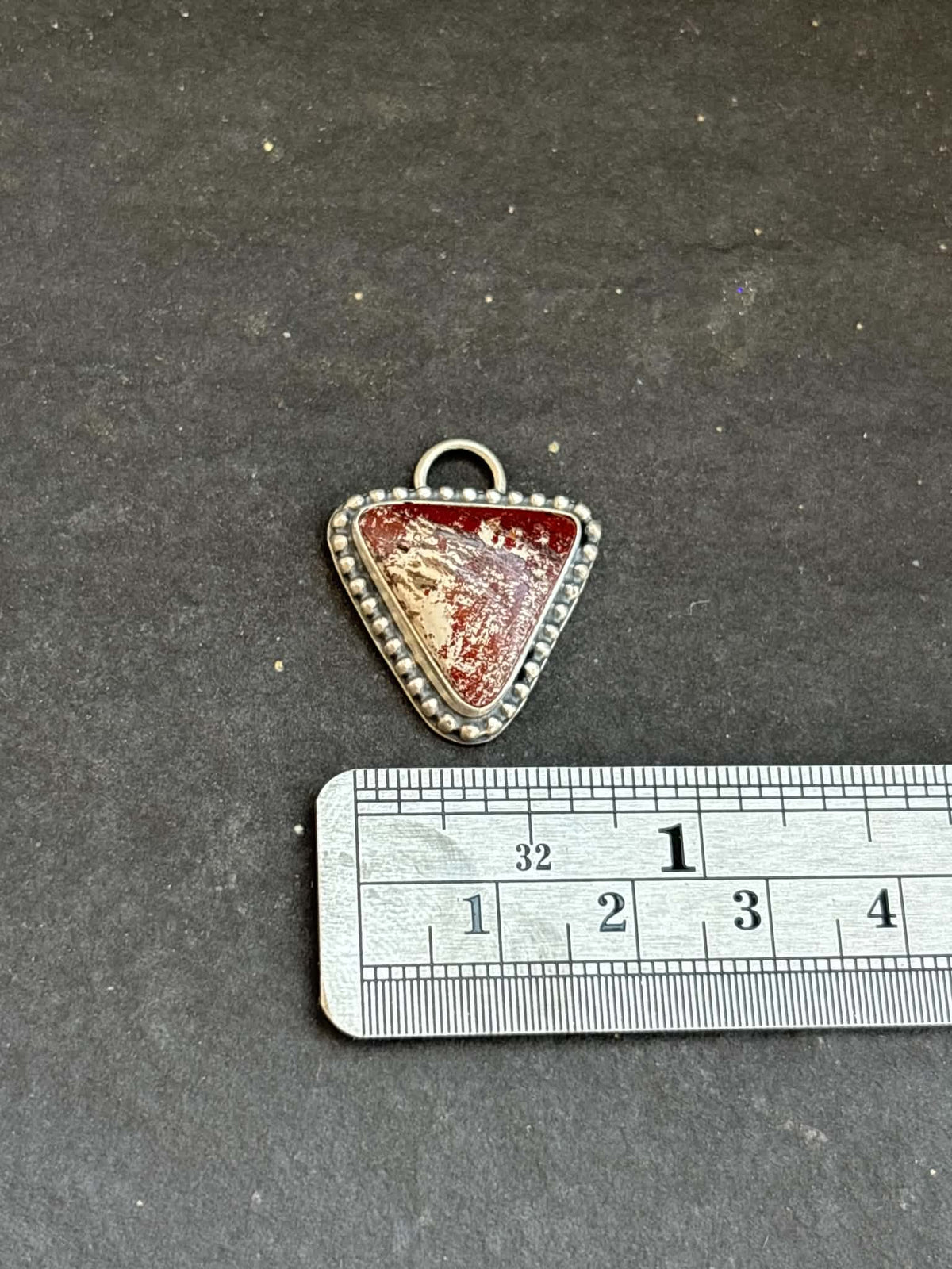 58. Red Buffalo Charm