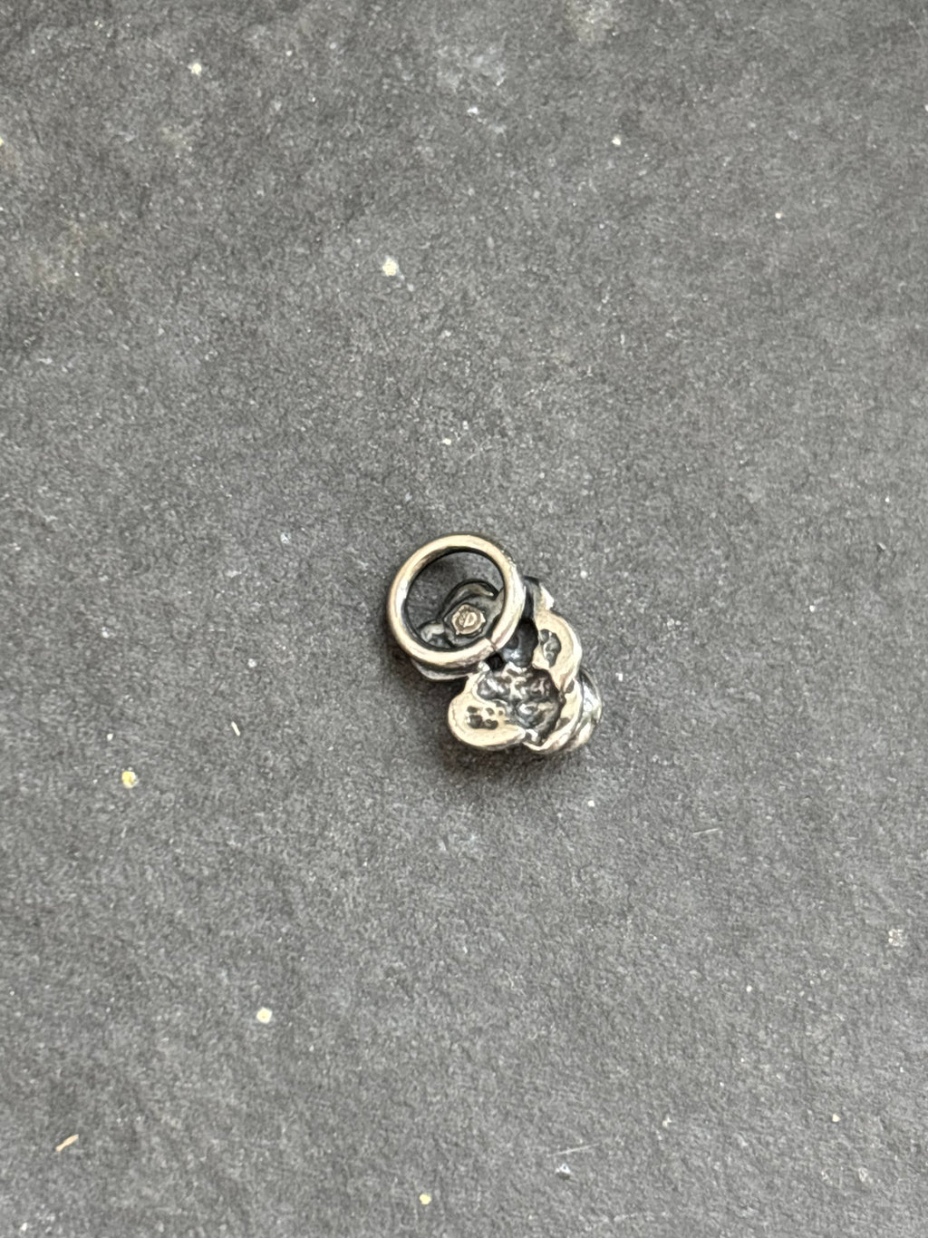 Back of the sterling silver Purple Spiny Oyster Baby Prickly Pear Cactus Charm, showing the attached bail.