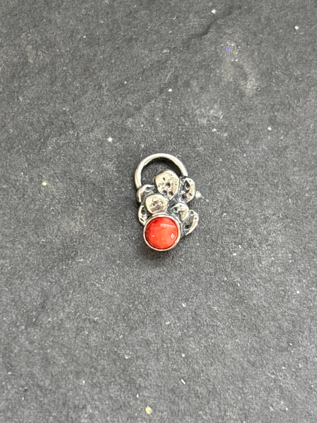 Front of a sterling silver Baby Prickly Pear Cactus Charm with red spiny oyster.