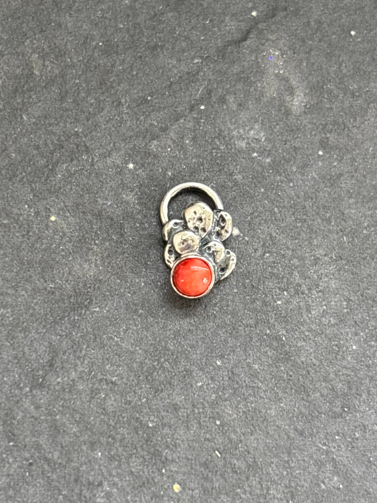 Front of a sterling silver Baby Prickly Pear Cactus Charm with red spiny oyster.