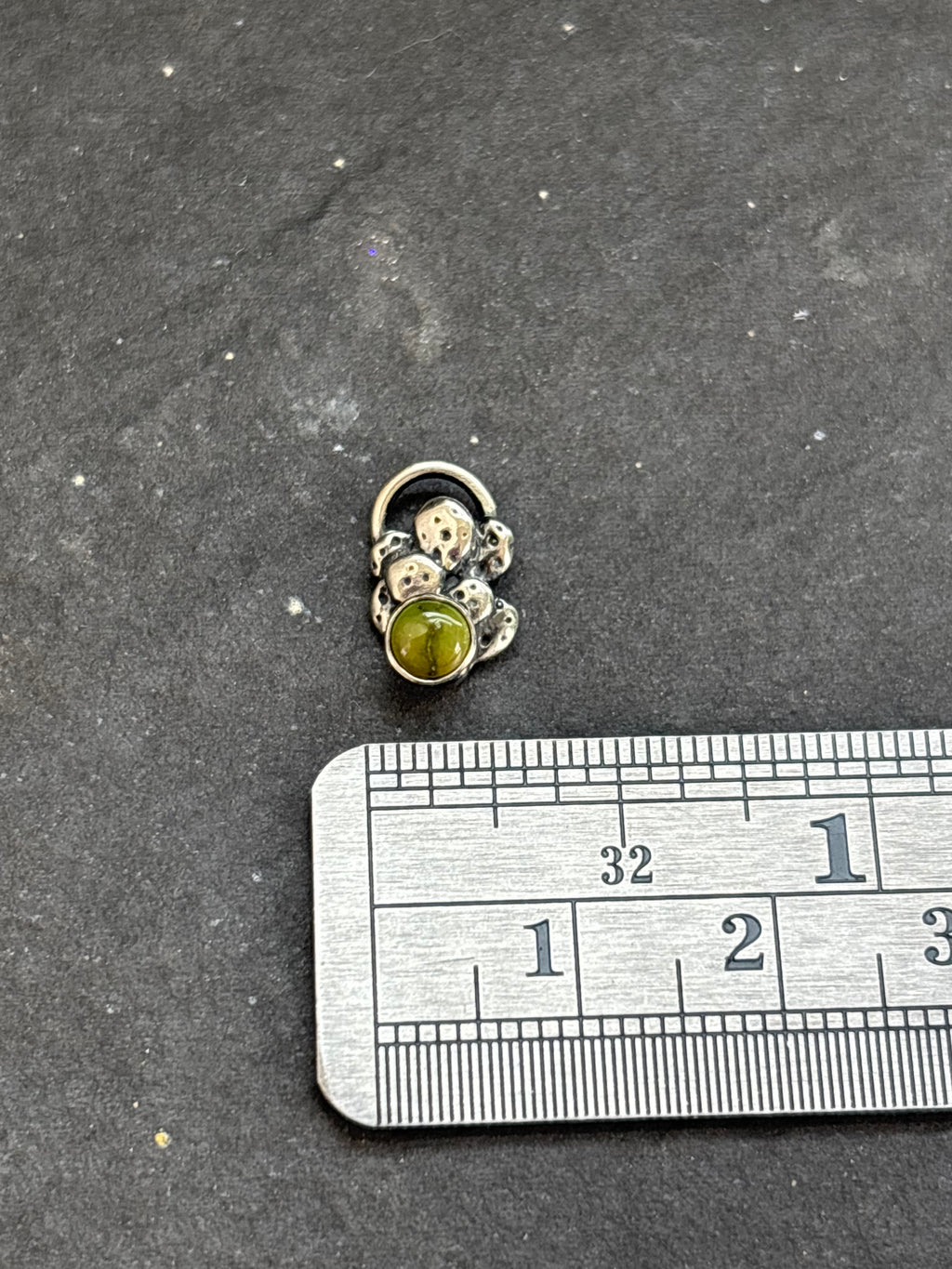 Sterling silver Sonoran Gold mini cactus charm above a horizontal ruler for width reference.