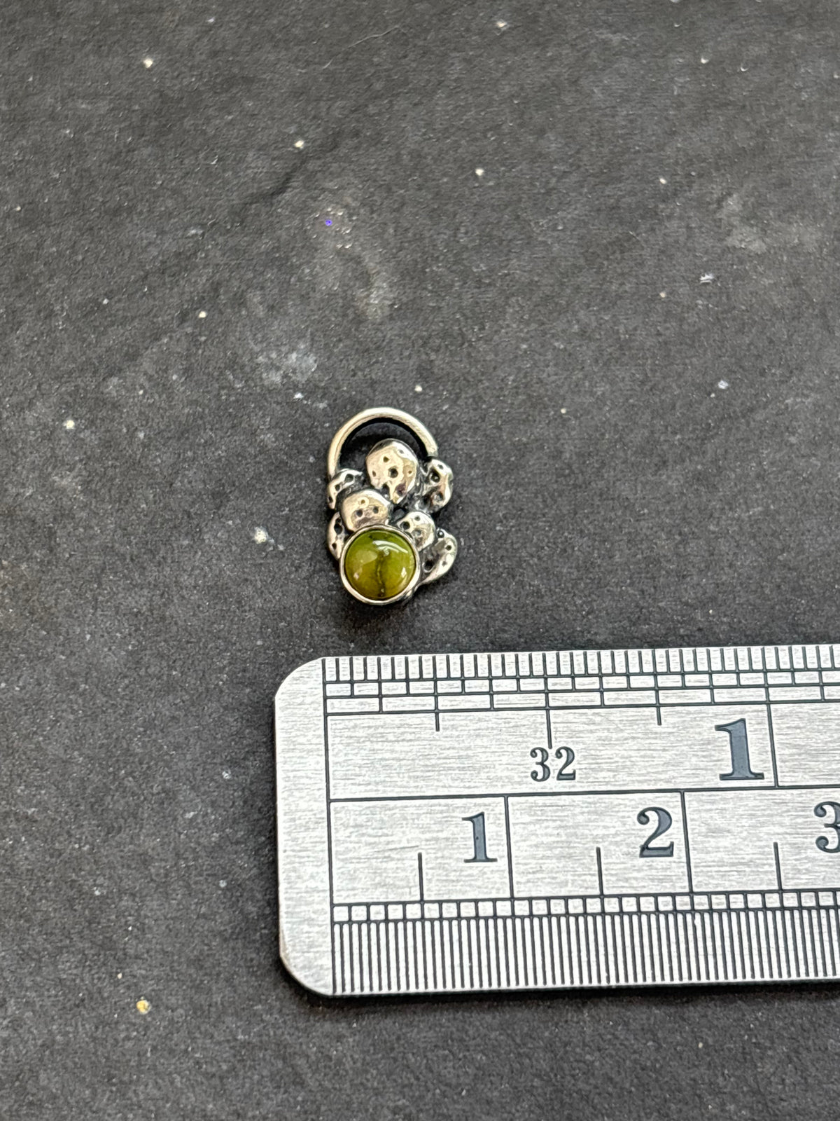 Sterling silver Sonoran Gold mini cactus charm above a horizontal ruler for width reference.